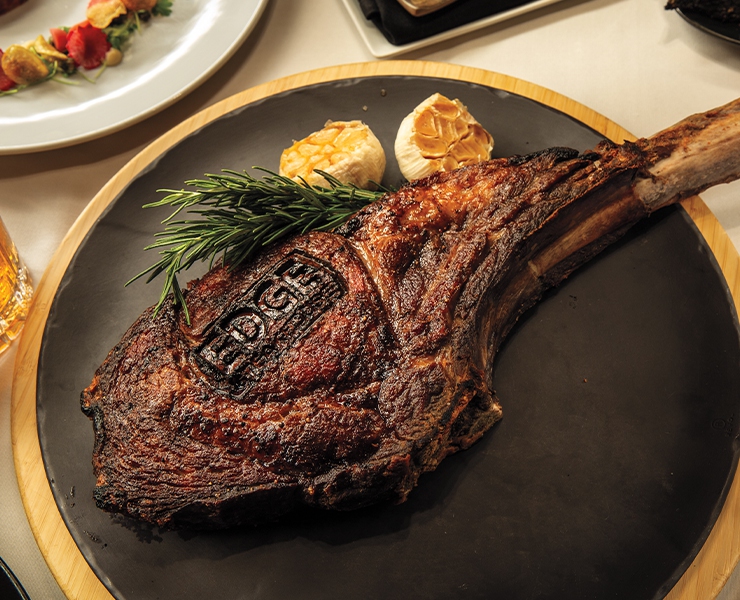 Edge Steakhouse signature dishes Wagyu Tomahawk RibeyeMaine Lobster TailDry-Aged New York StripTruffle Mac & Cheese